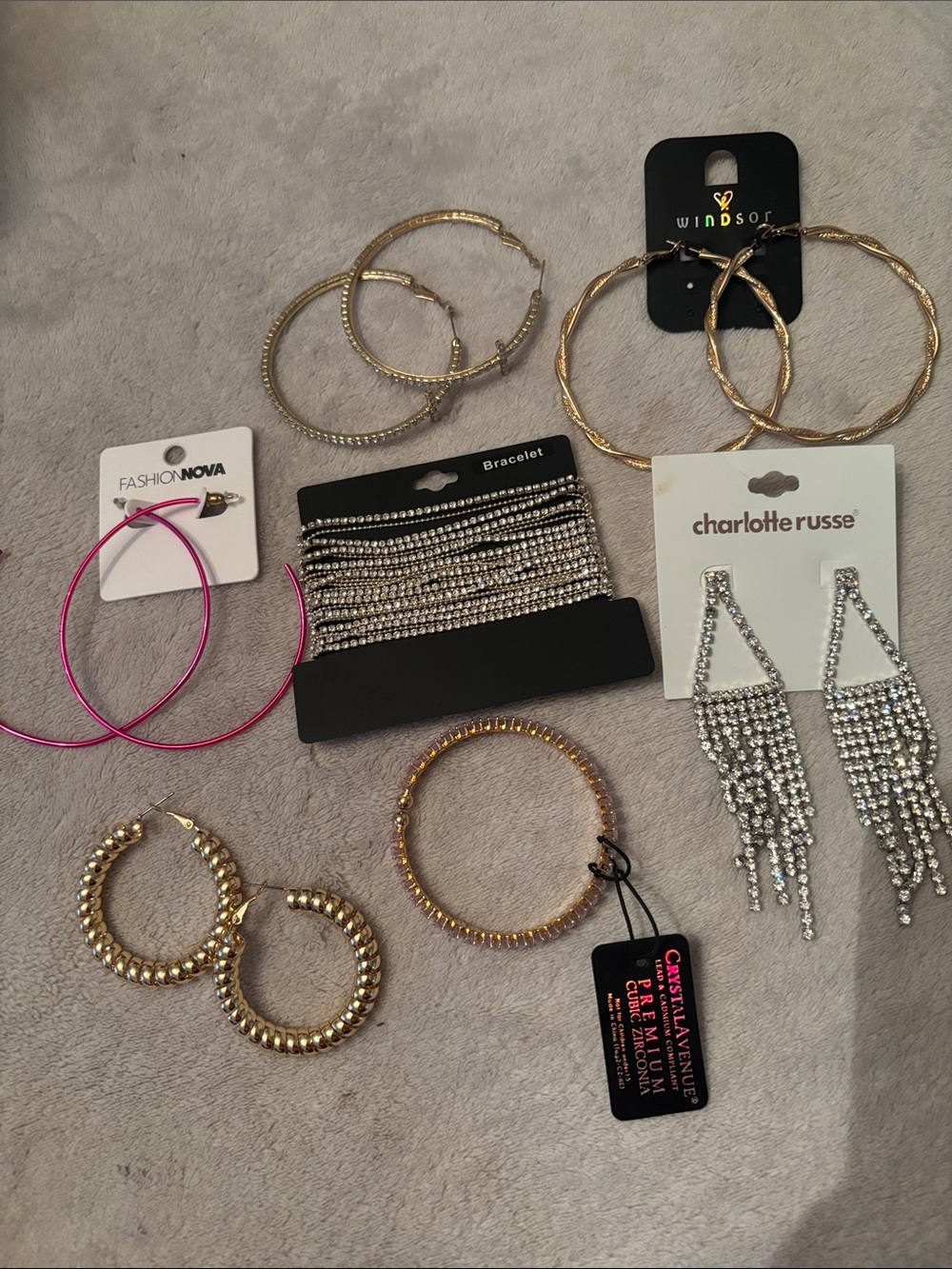 Charlotte Russe, Windsor & Fashion Nova gold and silver tone earring sets.